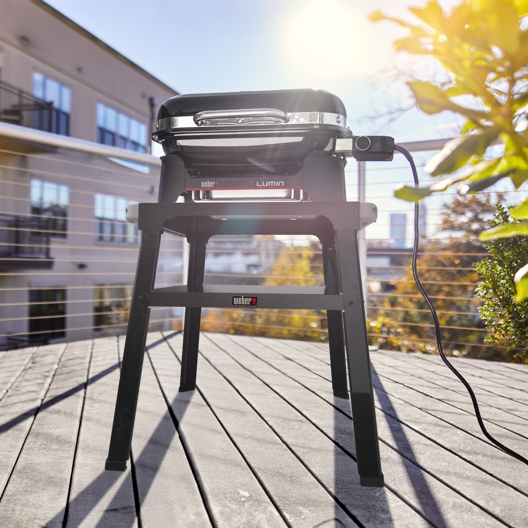 Barbacoa eléctrica para exteriores Lumin® Compact con soporte