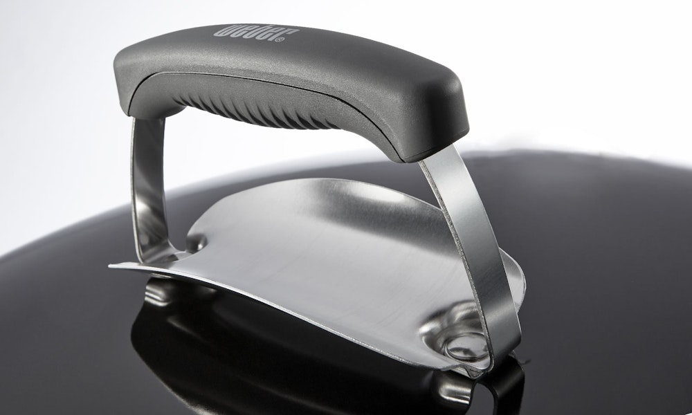 Poignée de couvercle avec protection contre la chaleur